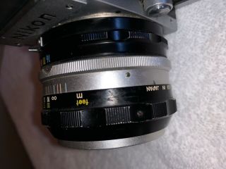Nikon F,  serial 6531479,  vintage camera with 50mm lens,  eye level prism plus 1 5