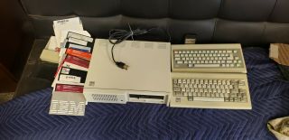 Vintage Computer.  1983 Ibm Pcjr.  Two Keyboards,  And Floppy Disks.