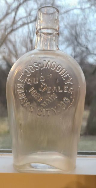 Kansas City Missouri.  1/2 Pt.  Coffin Flask Jos.  Mooney Liquor Dealer