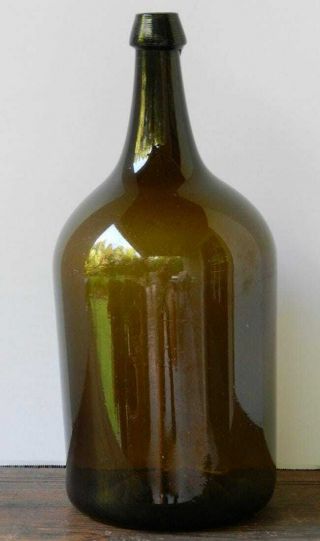 Very Good 19th Century Olive Amber Demijohn Water Bottle With Open Pontil.  14”
