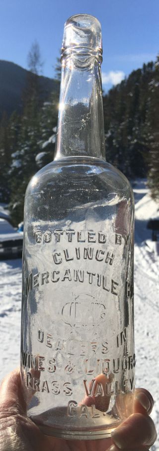 Early Grass Valley,  Ca.  Clinch Mercantile Co.  Embossed Whiskey Bottle