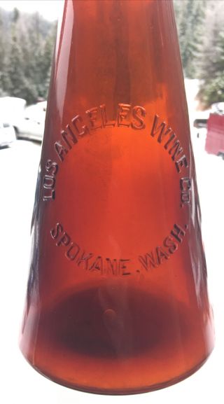Early Spokane,  Wa.  Los Angeles Wine Co.  Embossed Amber Megaphone Bottle