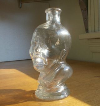 1870s CRYING BABY FIGURAL COLOGNE OR HAIR OIL BOTTLE EMB T.  P.  S&CO N.  Y. 2