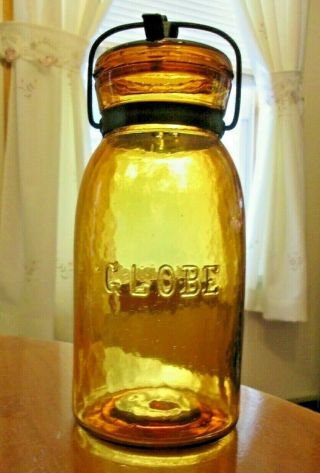 A Very Light Yellow Amber Globe Canning Jar Complete With Lid And Closu