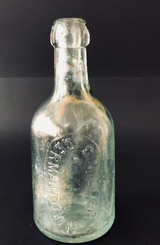 Antique Blob Squat Germantown Light Green Embossed Bottle C.  Miller