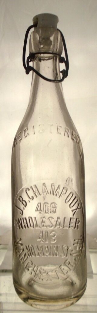 J.  B.  Champoux Manchester,  Hampshire Antique Blob Top Pint Beer Bottle.