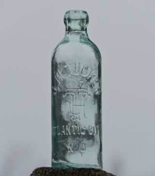J.  H.  Tucker Atlantic City,  N.  J. ,  Monogram Embossed,  Aqua Hutchinson Soda Bottle