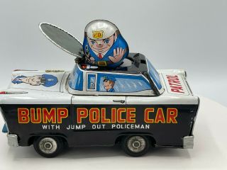 Rare Vintage W - Toy Japan Tin Friction Bump Police Car W/ Jump Out Policeman 6.  5 "